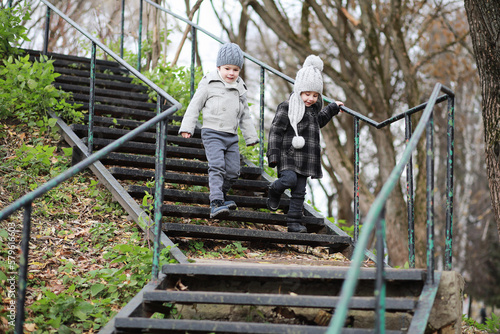 Children walk in the autumn park