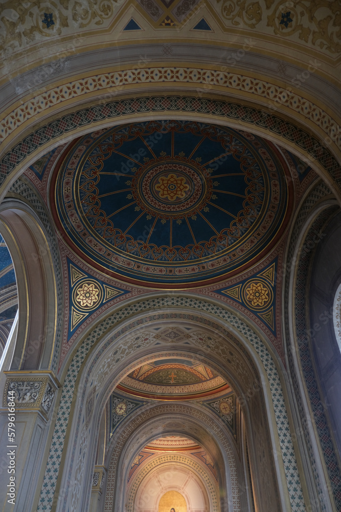 Monumental church building in Gothic in neo-romanesque arch style with large ceiling and altar murals and fresco, opulent detailed columns and marble structures Monumental church building in Gothic in neo-romanesque arch style with large ceiling and altar murals and fresco, opulent detailed columns and marble structures