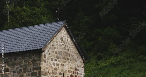 Holy cross on renovated roof of Mtsvane monastery church in Georgia. photo