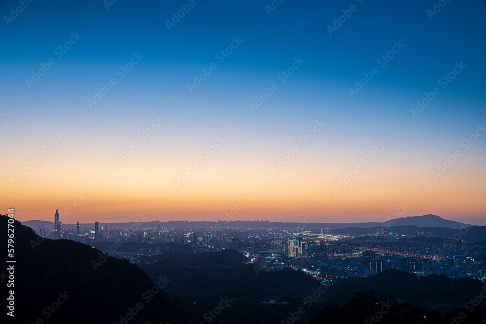 Silhouette of Taipei City at dusk. The sun moves towards the horizon. Pay attention to climate change and industrial development. Taiwan