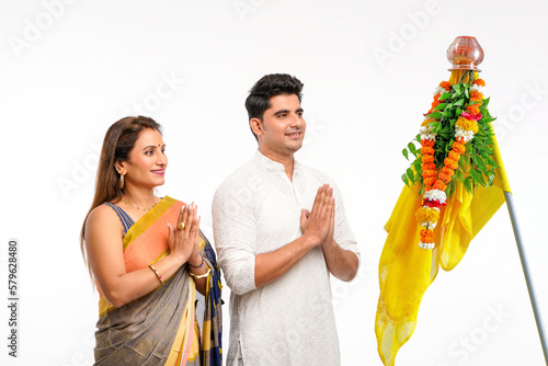 Indian Couple praying and celebrating Gudi Padwa festival. gudi padwa is marathi new year. photo