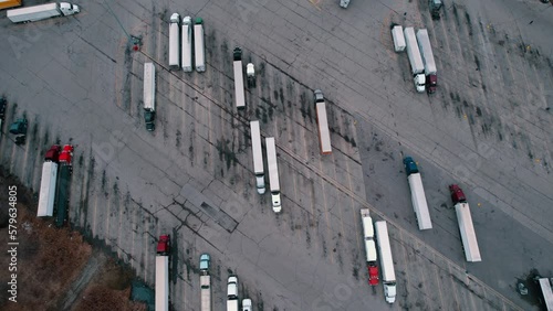 birds eye view aerial of top down truck stop aerial view. Carhauler, dryvan, reefers, flatabed, bobtails parked. USA 4k Aerial photo