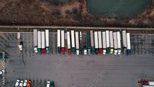 top down truck stop aerial view. Carhauler, dryvan, reefers, flatabed, bobtails parked. USA 4k Aerial photo