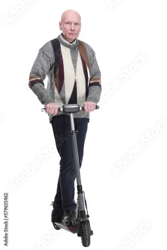 serious mature man with electric scooter. isolated on a white background. © ASDF