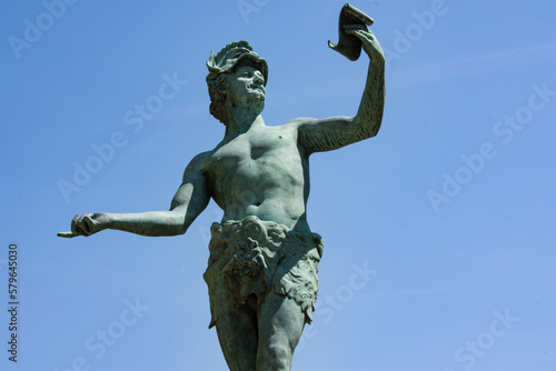 Low angle view of statue against blue sky at Le Jardin du Luxembourg during sunny day photo