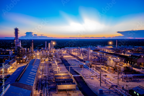 High angle view of illuminated petrochemical plant against blue sky at Permian Basin during sunset