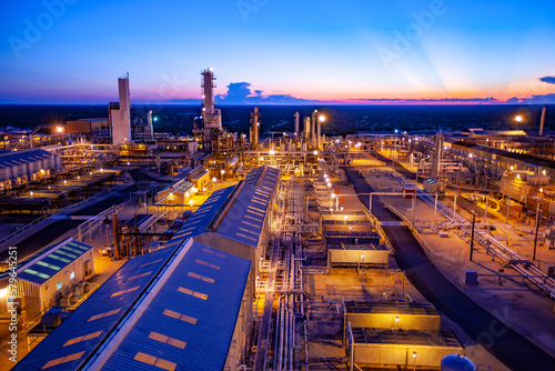 High angle view of illuminated petrochemical plant against blue sky at Permian Basin