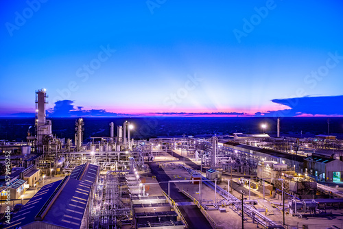 High angle view of illuminated petrochemical plant against blue sky at Permian Basin during dusk