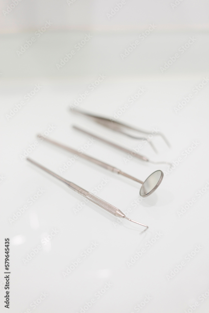 High angle view of dental equipment on white table in medical clinic High angle view of dental equipment on white table in medical clinic