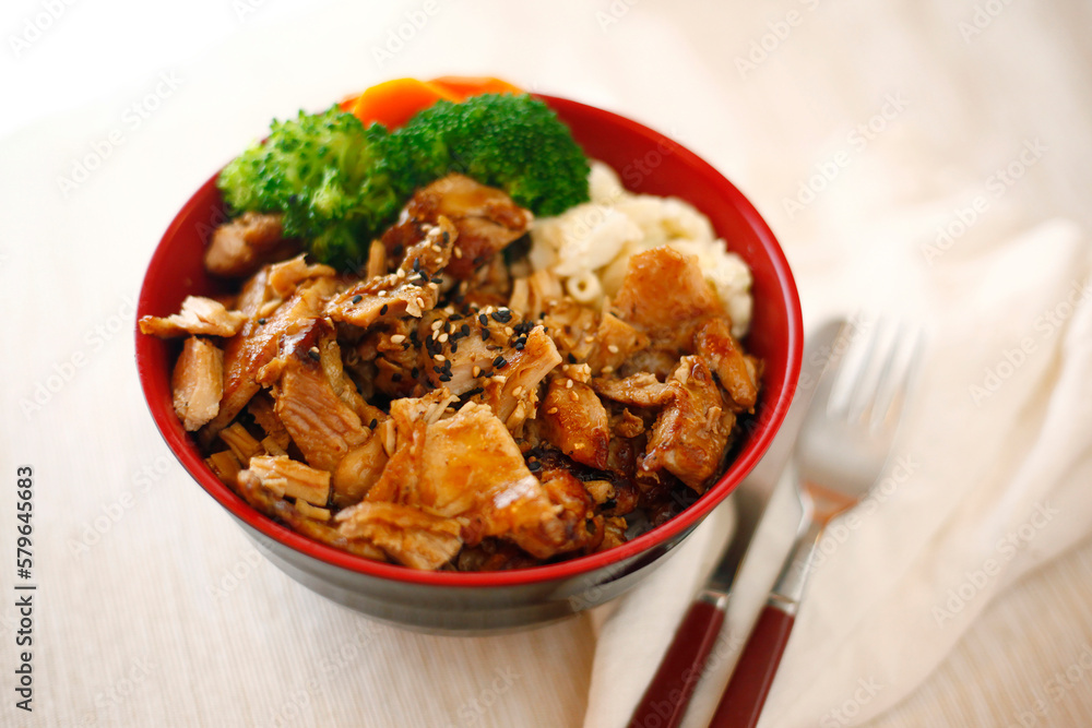 High angle close-up of meat with broccoli and pasta served in bowl on table High angle close-up of meat with broccoli and pasta served in bowl on table