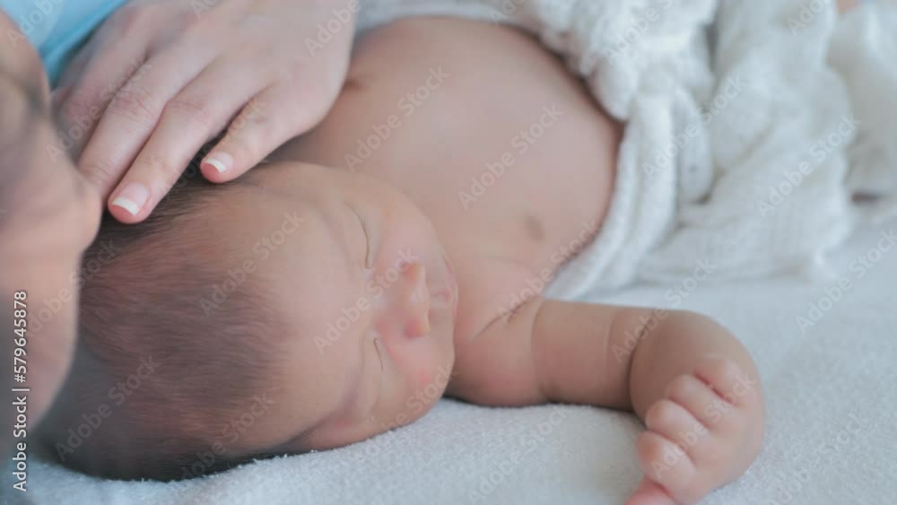 Mother cares for baby, comforting, and support, a newborn at home Mother cares for baby, comforting, and support, a newborn at home
