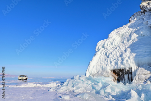 Rock Cliffs of Elenka Island Covered with Ice Formations on Frozen Lake Baikal