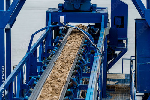 Industrial belt conveyor moving raw materials from mine