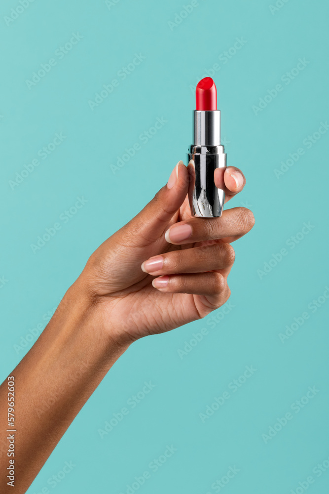 Crop black woman showing lipstick Crop black woman showing lipstick