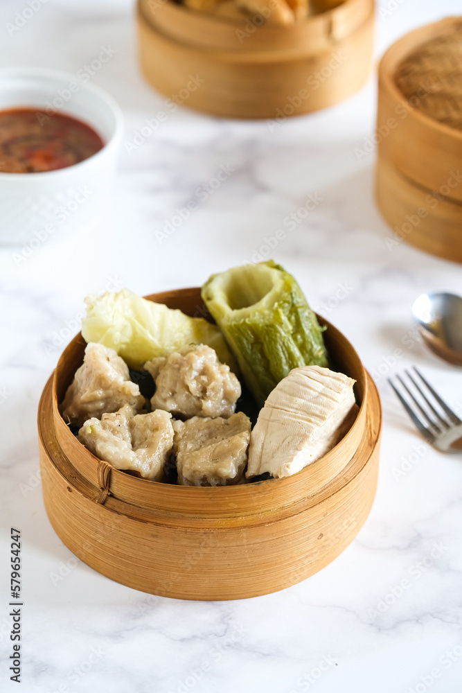 siomay, Indonesian traditional food, steamed fish dumpling with peanut sauce siomay, Indonesian traditional food, steamed fish dumpling with peanut sauce