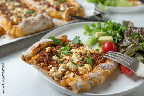 Turkish pide with mince meat, vegetable, feta cheese topping