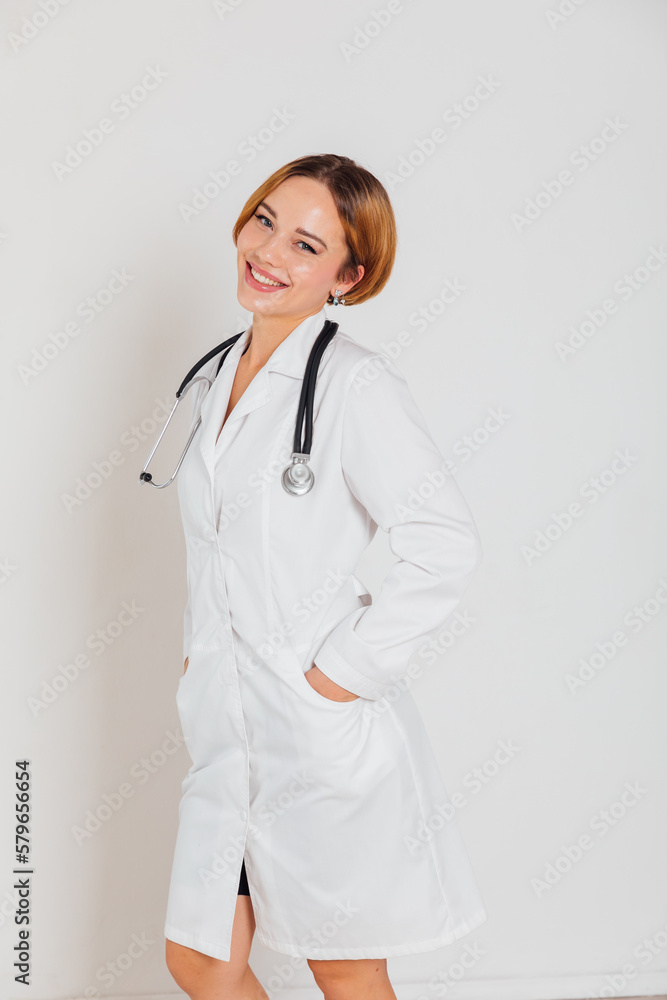 woman doctor in white coat with phonendoscope stethoscope in hospital woman doctor in white coat with phonendoscope stethoscope in hospital