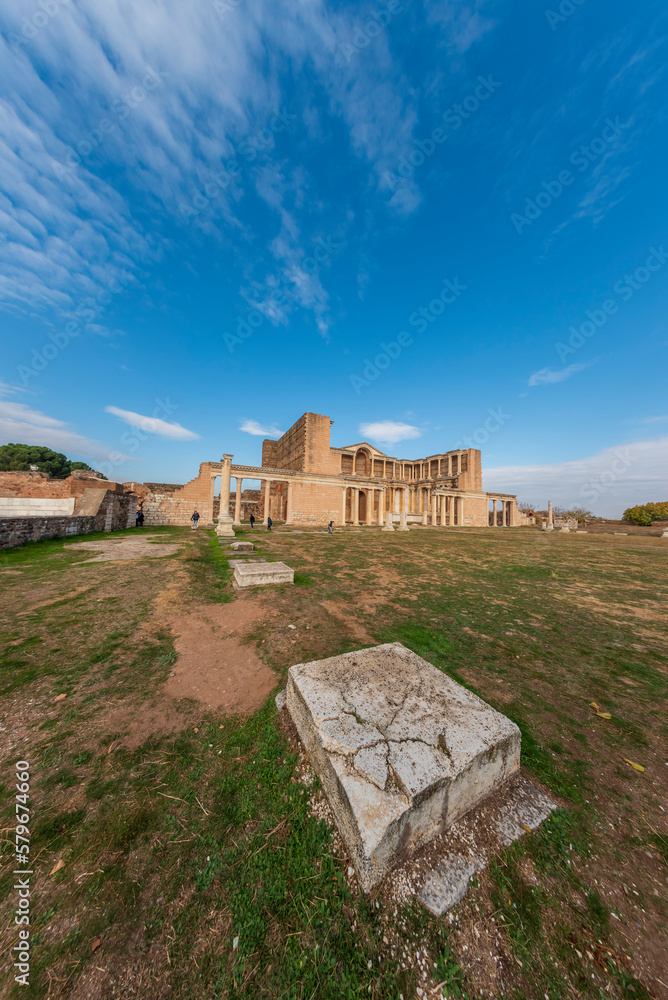 Sardes ancient city ruins with different angles on a sunny day with beautiful blue sky and clouds