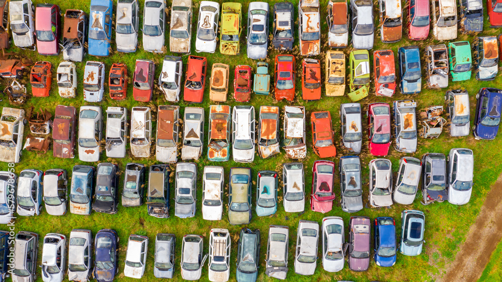 Aerial view of a junkyard. Large parking lot of old, broken and demolished cars.