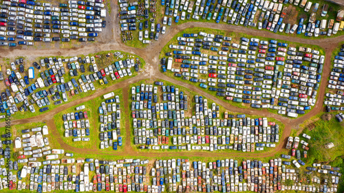 Aerial view of a junkyard. Large parking lot of old, broken and demolished cars.