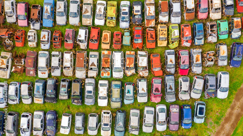 Aerial view of a junkyard. Large parking lot of old  broken and demolished cars.