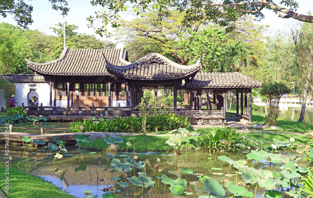 Fototapeta premium Traditional Chinese Garden with Stunning Viewing Pavilions on Water Lilies Pond