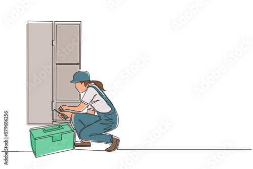 Single one line drawing repair, maker or constructions of wood home furniture. Woman carpenter is assembling of wardrobe or cabinet with shelves. Modern continuous line draw design graphic vector