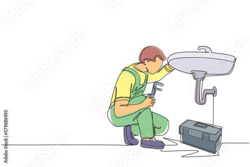 Continuous one line drawing plumber worker repairs sink in bathroom and plumbing pipes. Handyman makes house repair works. Home repair and maintenance services concept. Single line draw design vector