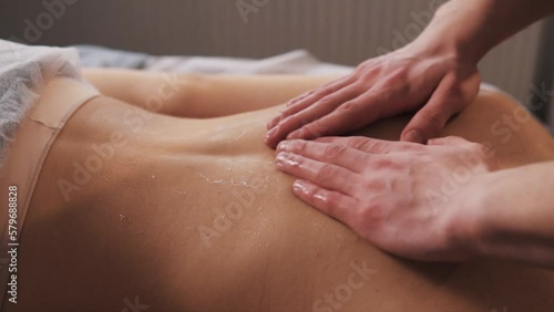 Wallpaper Mural close-up A male masseur applies foam to a young woman's back before the procedure Torontodigital.ca