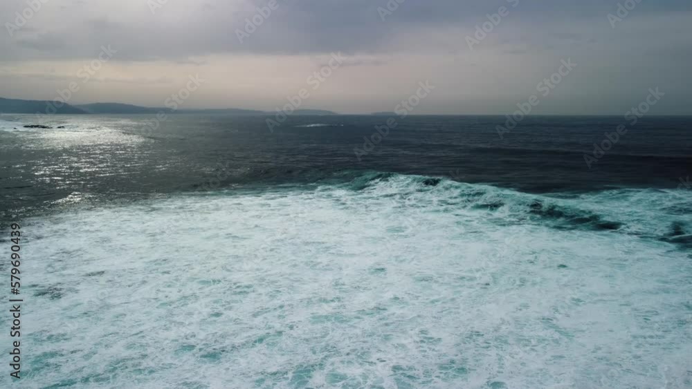 Atmospheric Beach With Foamy Rough Waves During Stormy Day In Caion, Coruna Spain. Aerial Drone Atmospheric Beach With Foamy Rough Waves During Stormy Day In Caion, Coruna Spain. Aerial Drone