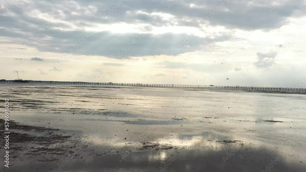 Flat seabed at low tide, wet ground with puddles Flat seabed at low tide, wet ground with puddles