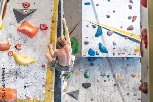 climbing on a boulder wall in a climbing center