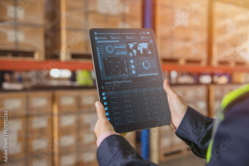 Smart warehouse management system for real time monitoring products storage shipping.  Computer logistics screen showing inventory dashboard stock control software. photo