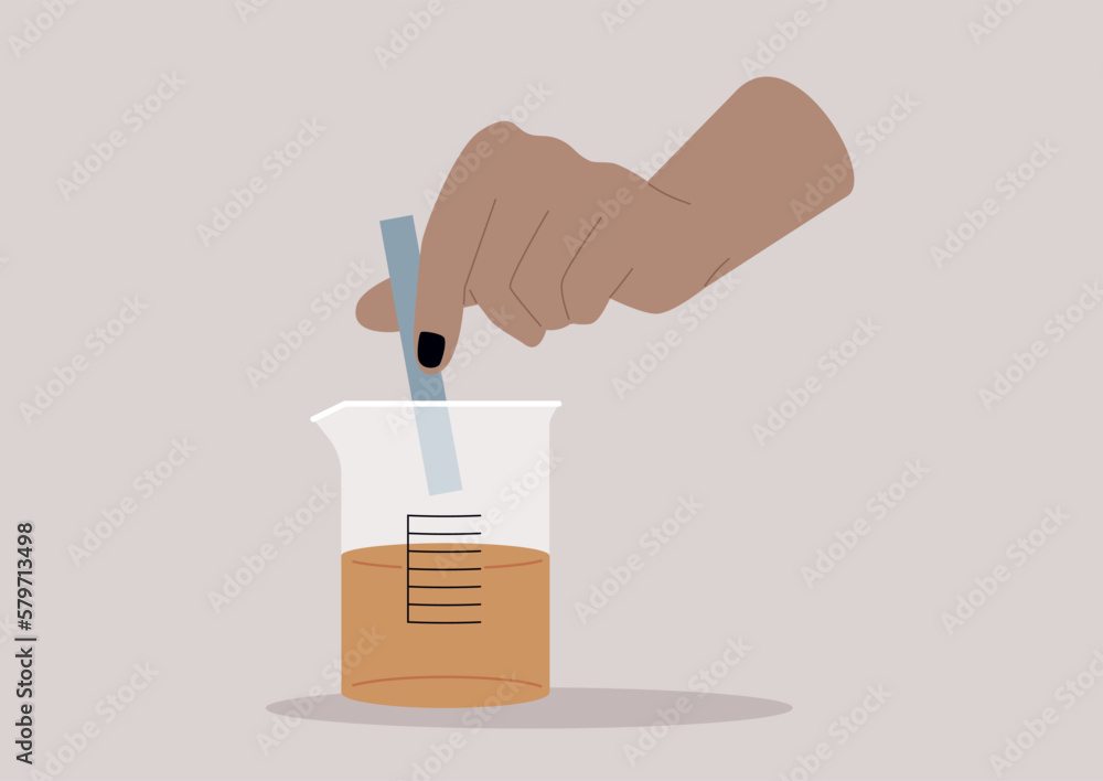 Litmus test, a hand putting a blue strip of paper into a glass beaker Litmus test, a hand putting a blue strip of paper into a glass beaker