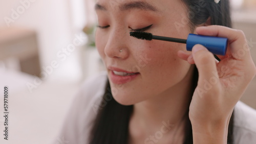 Makeup  mascara and Asian bride beauty talking with professional makeup artist  eyelashes care and wedding preparation. Cosmetics  marriage and woman ready for luxury ceremony  event or day at salon.