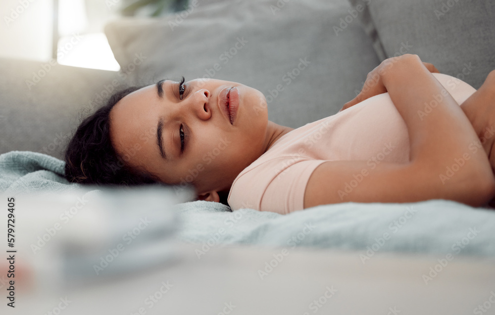 Alone, buried deep in a carcass searching for a soul. Shot of an exhausted female sleeping through depression at home. Alone, buried deep in a carcass searching for a soul. Shot of an exhausted female sleeping through depression at home.