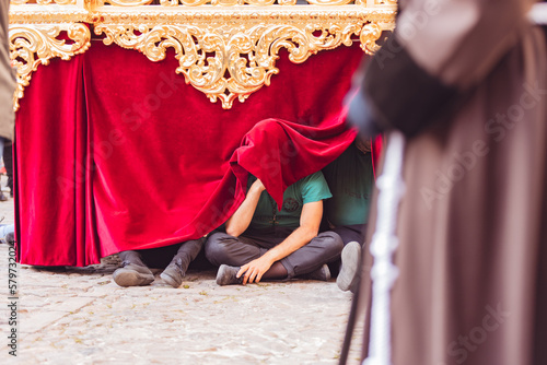 confreres resting on the ground in holy week