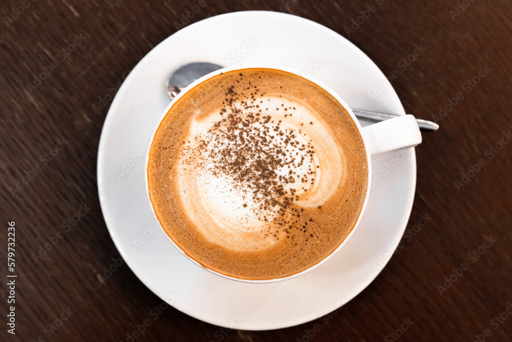 Cup of Cappuccino. Coffee with milk foam and cinnamon powder Cup of Cappuccino. Coffee with milk foam and cinnamon powder
