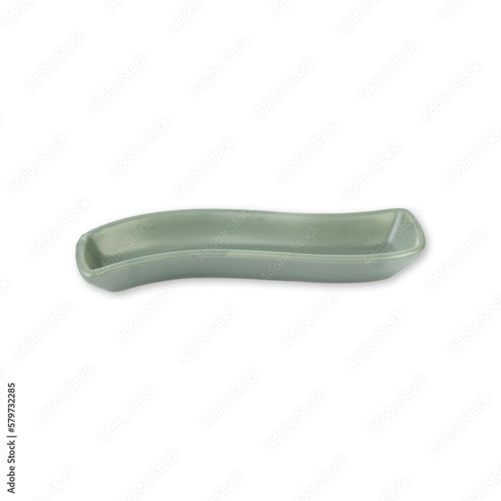 Small green wave shaped ceramic plate isolated over white background Small green wave shaped ceramic plate isolated over white background