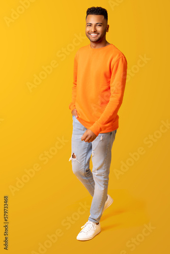 Canvas Print Full length photo of young smiling happy indian 20s man in casual wear isolated