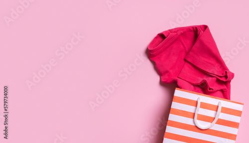 Children's clothes in shopping bag. Second hand, clothing recycling concept