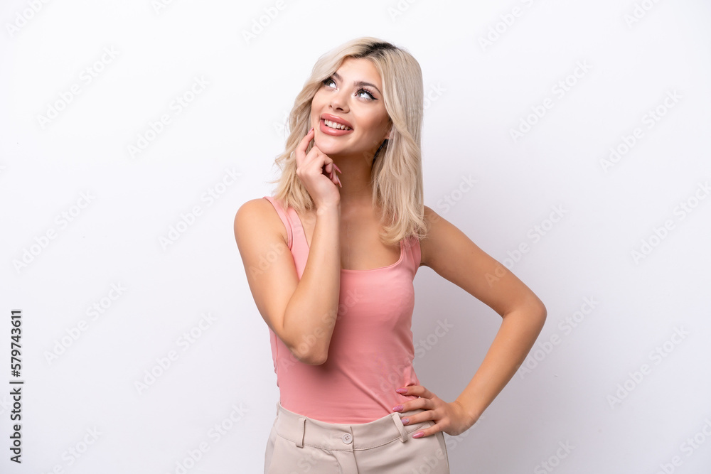 Young Russian woman isolated on white background thinking an idea while looking up Young Russian woman isolated on white background thinking an idea while looking up