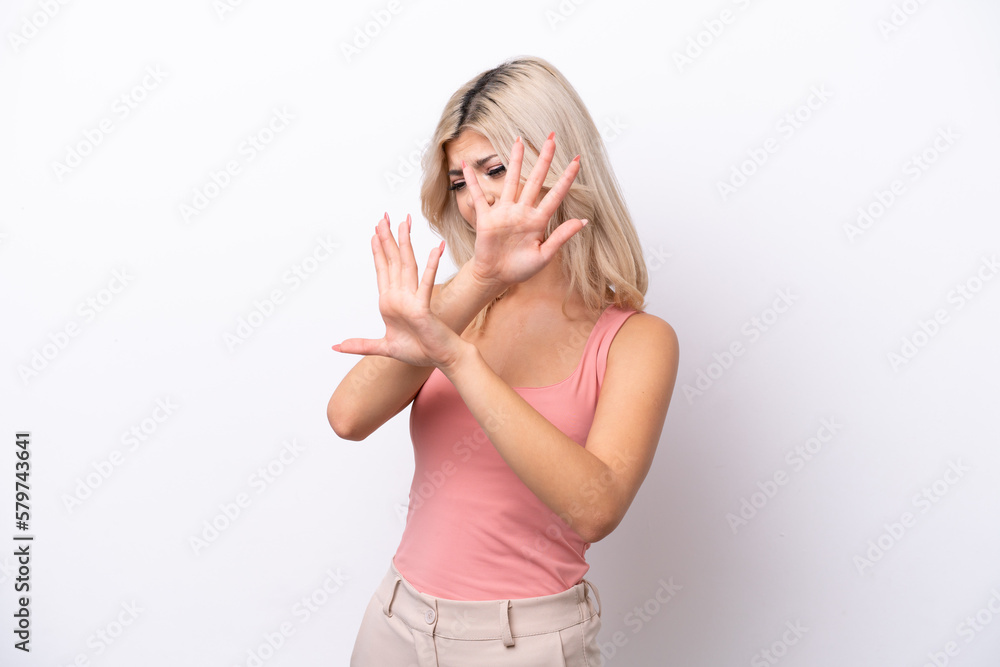 Young Russian woman isolated on white background nervous stretching hands to the front Young Russian woman isolated on white background nervous stretching hands to the front