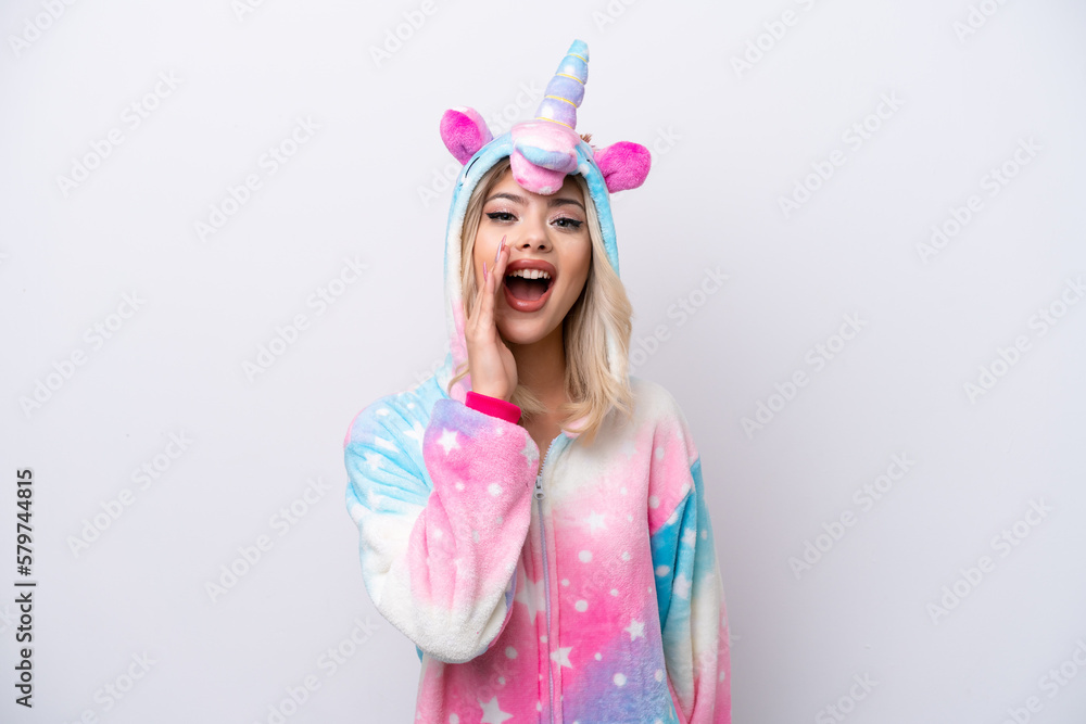 Young Russian woman with unicorn pajamas isolated on white background with surprise and shocked facial expression Young Russian woman with unicorn pajamas isolated on white background with surprise and shocked facial expression
