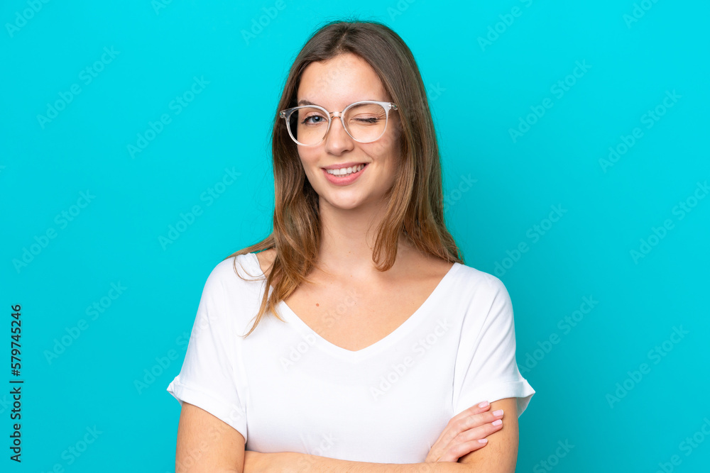 Young caucasian woman isolated on blue background With glasses and happy expression Young caucasian woman isolated on blue background With glasses and happy expression