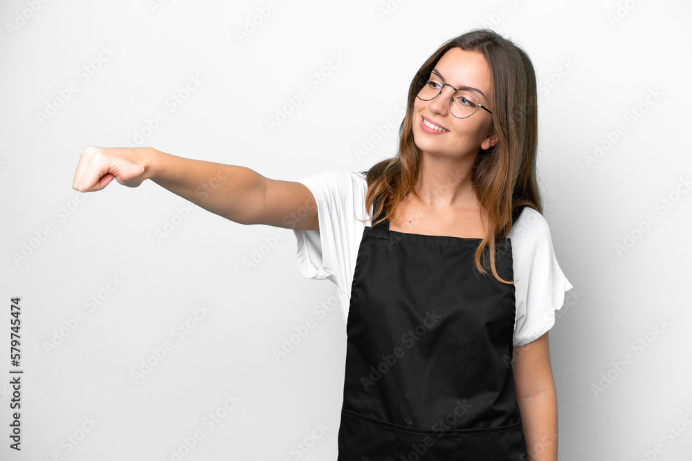 Young caucasian restaurant waiter woman isolated on white background giving a thumbs up gesture Young caucasian restaurant waiter woman isolated on white background giving a thumbs up gesture