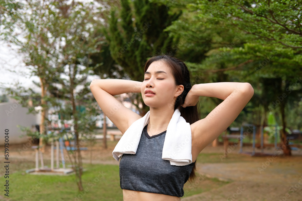 Relaxed runner stretching arms after exercise Relaxed runner stretching arms after exercise
