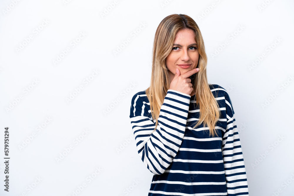 Young Uruguayan woman isolated on white background having doubts Young Uruguayan woman isolated on white background having doubts
