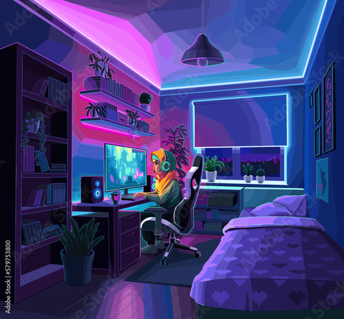 Girl gamer or streamer with a headset sits in front of a computer in a cozy room