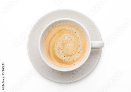 Black fresh hot creamy coffee in light porcelain cup on white background.